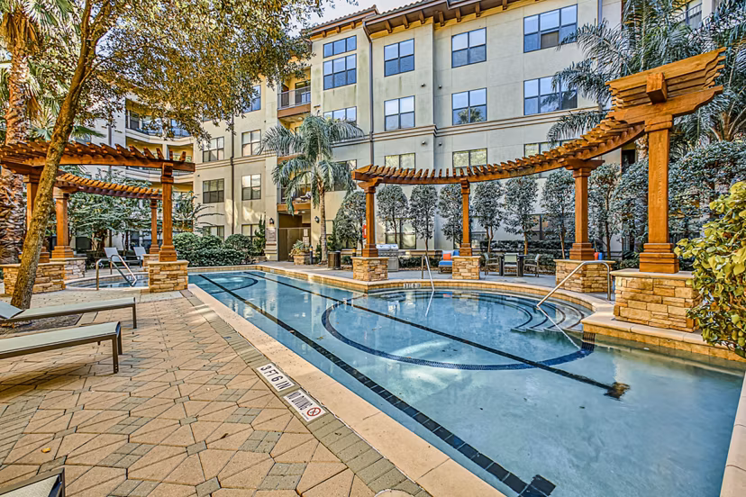 Luxury poolside lounging area at Broadstone Toscano Apartments