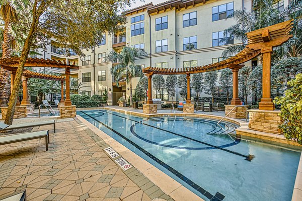 Luxury poolside lounging area at Broadstone Toscano Apartments
