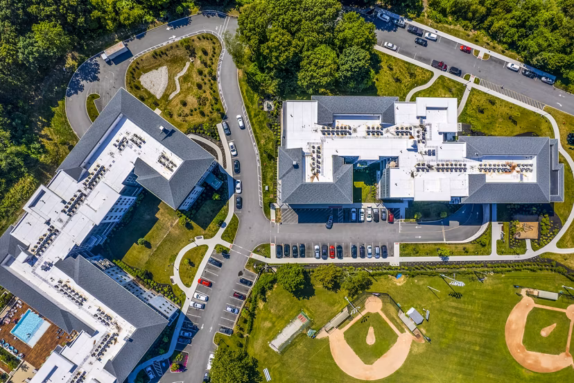 The Cove Apartments: Aerial view of luxury apartments in bustling urban setting