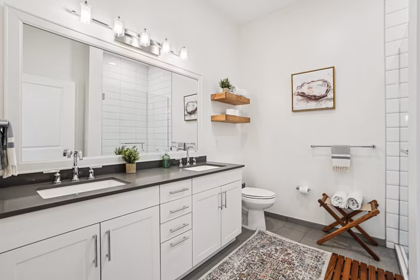 Modern bathroom featuring sleek fixtures and spacious design at The Cove Apartments