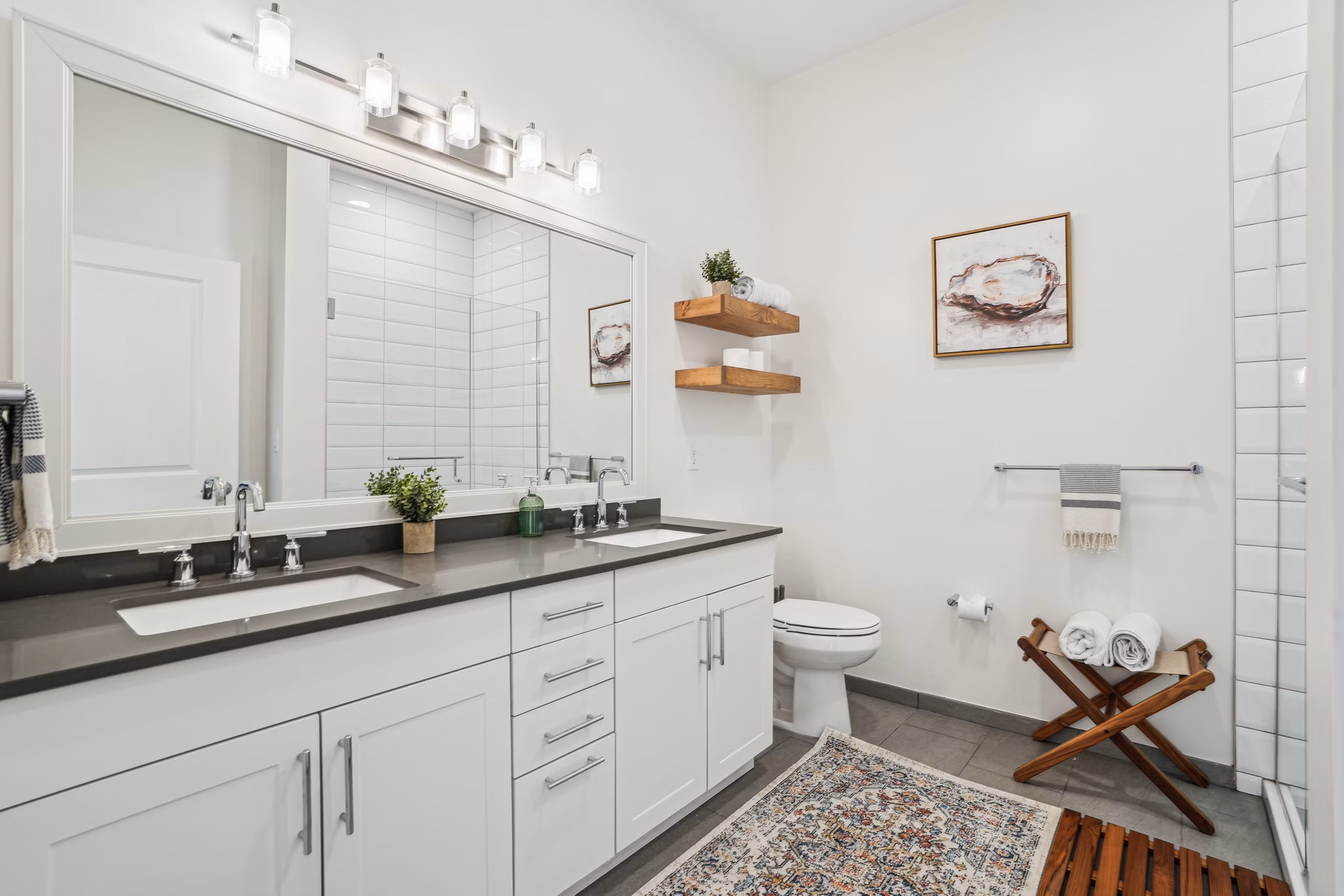Modern bathroom featuring sleek fixtures and spacious design at The Cove Apartments