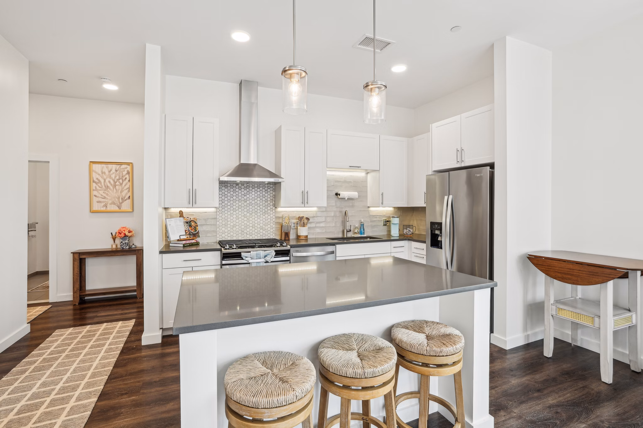 Modern kitchen with stainless steel appliances at The Cove Apartments, luxury rentals in vibrant cityscape