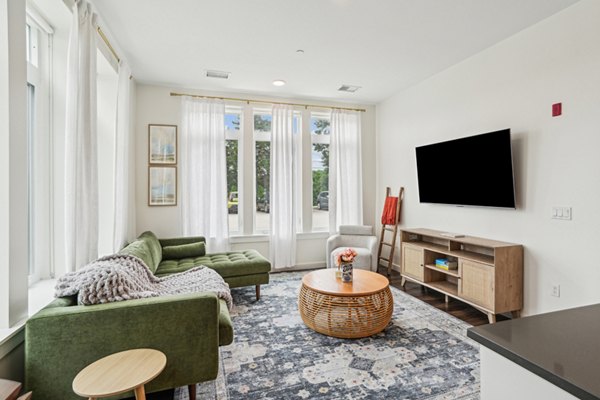 Spacious living room with modern decor in The Cove Apartments