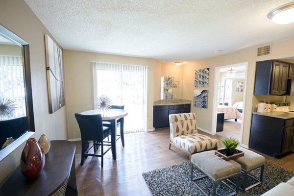 Spacious living room with modern decor at Oaks at Greenview Apartments, offering luxury living and comfort