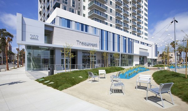 Brand signage at The Current Apartments showcasing luxury living in vibrant urban location