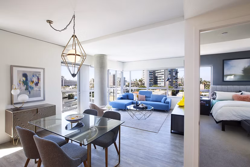 Bright bedroom with modern decor at The Current Apartments, offering luxury living experiences in a prime location