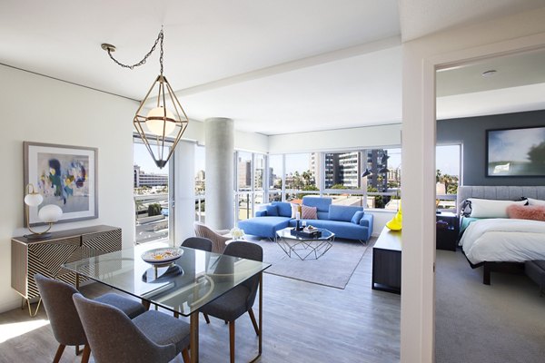 Bright bedroom with modern decor at The Current Apartments, offering luxury living experiences in a prime location