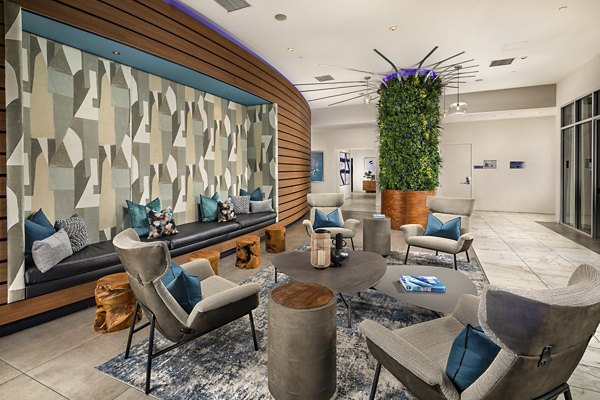 Modern lobby with sleek furnishings at The Current Apartments, a luxury Greystar property in a prime urban location