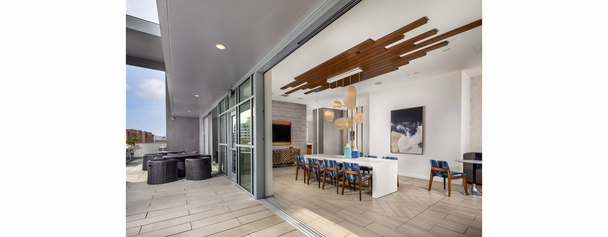 Clubhouse featuring modern decor and seating at The Current Apartments in luxury Greystar community