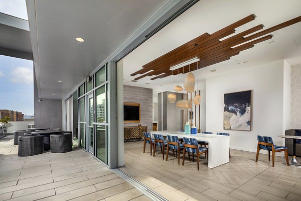 Clubhouse featuring modern decor and seating at The Current Apartments in luxury Greystar community