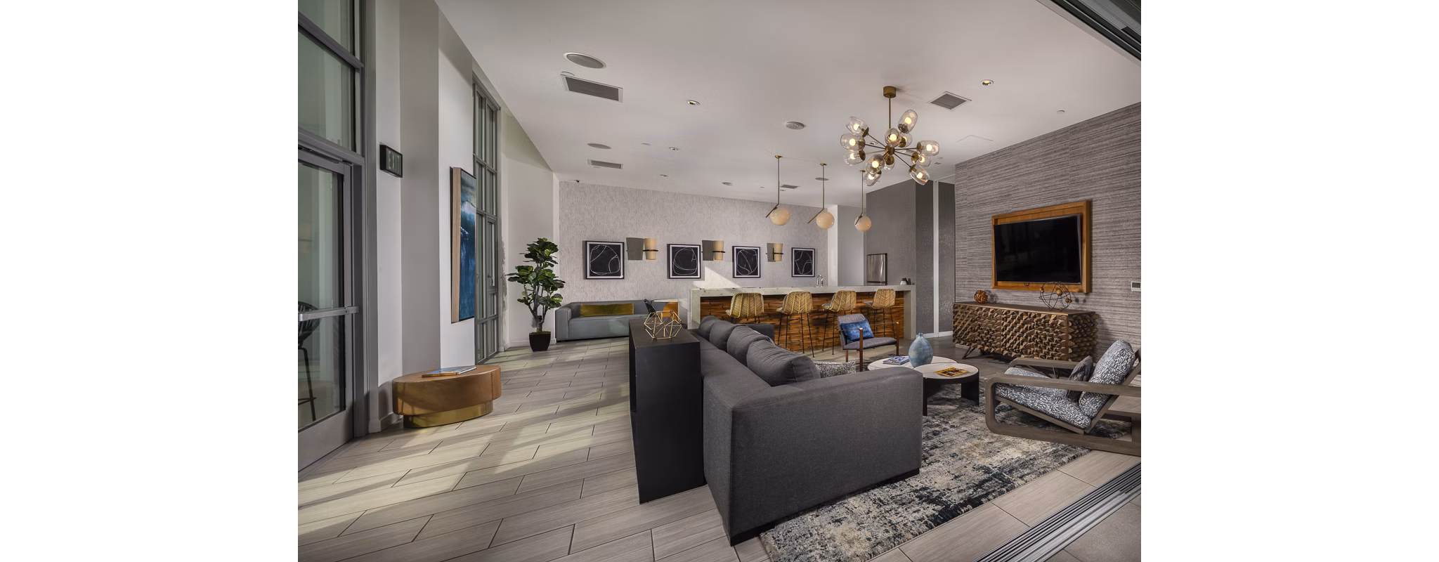 The Current Apartments: Stylish clubhouse with modern furnishings and entertainment options for luxury living
