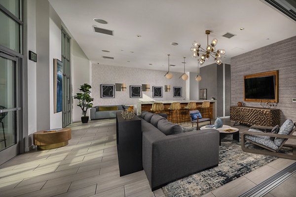 The Current Apartments: Stylish clubhouse with modern furnishings and entertainment options for luxury living