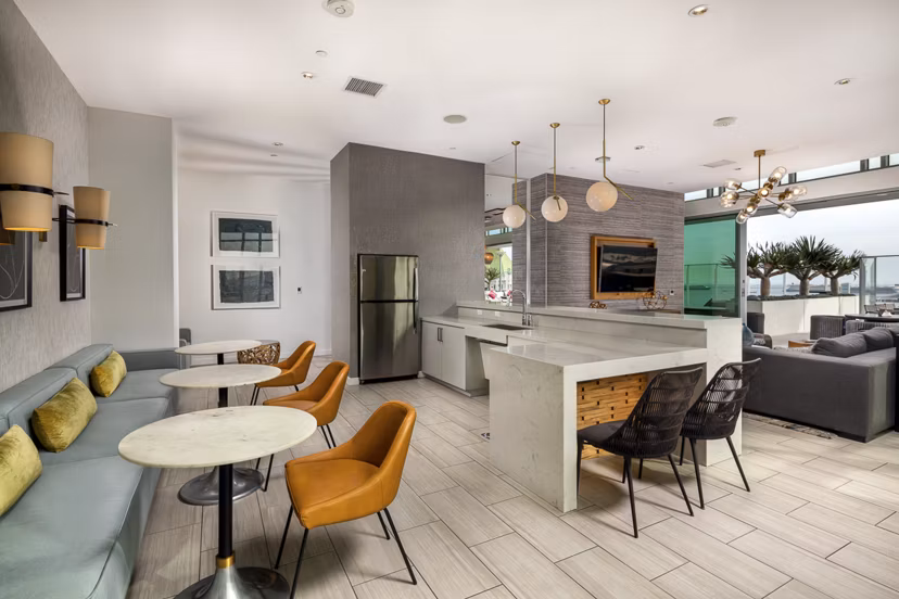 Stylish lobby with elegant seating and modern decor at The Current Apartments, offering a luxurious welcome to residents and guests