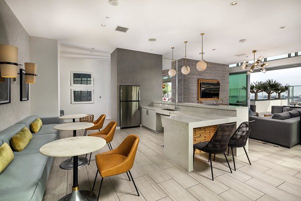 Stylish lobby with elegant seating and modern decor at The Current Apartments, offering a luxurious welcome to residents and guests
