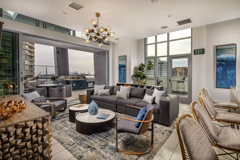 Modern lobby with contemporary furnishings at The Current Apartments, offering a welcoming entrance for residents and guests in this luxury community