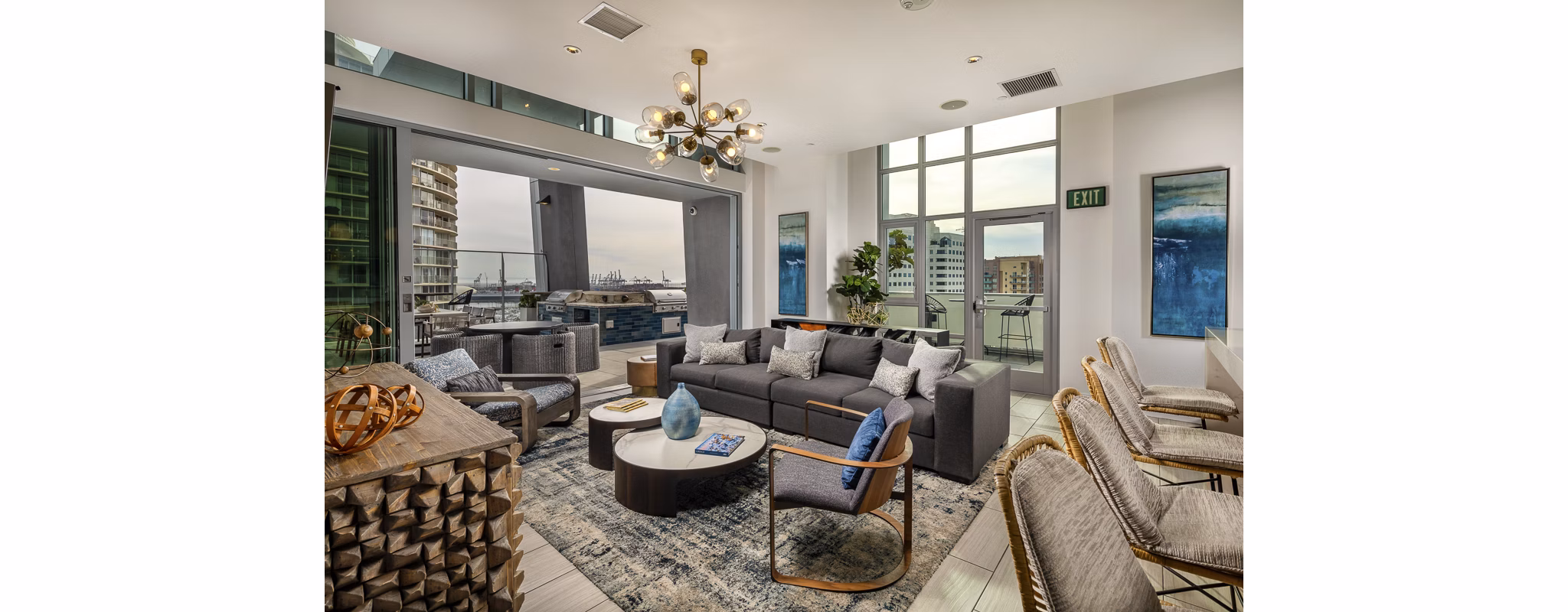 Modern lobby with contemporary furnishings at The Current Apartments, offering a welcoming entrance for residents and guests in this luxury community