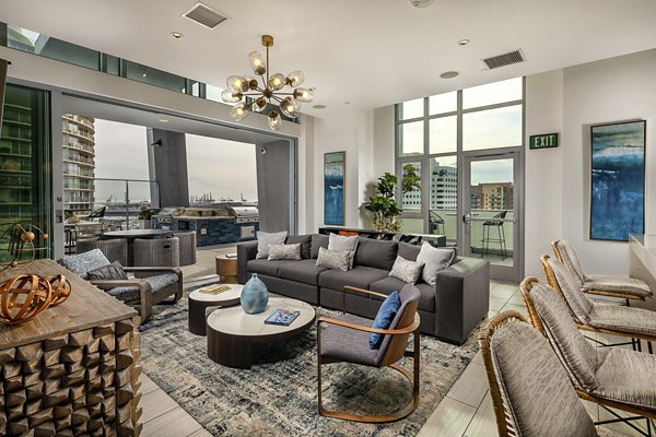 Modern lobby with contemporary furnishings at The Current Apartments, offering a welcoming entrance for residents and guests in this luxury community