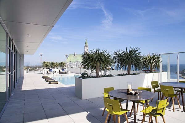 Patio with comfortable seating at The Current Apartments offering luxury outdoor living spaces
