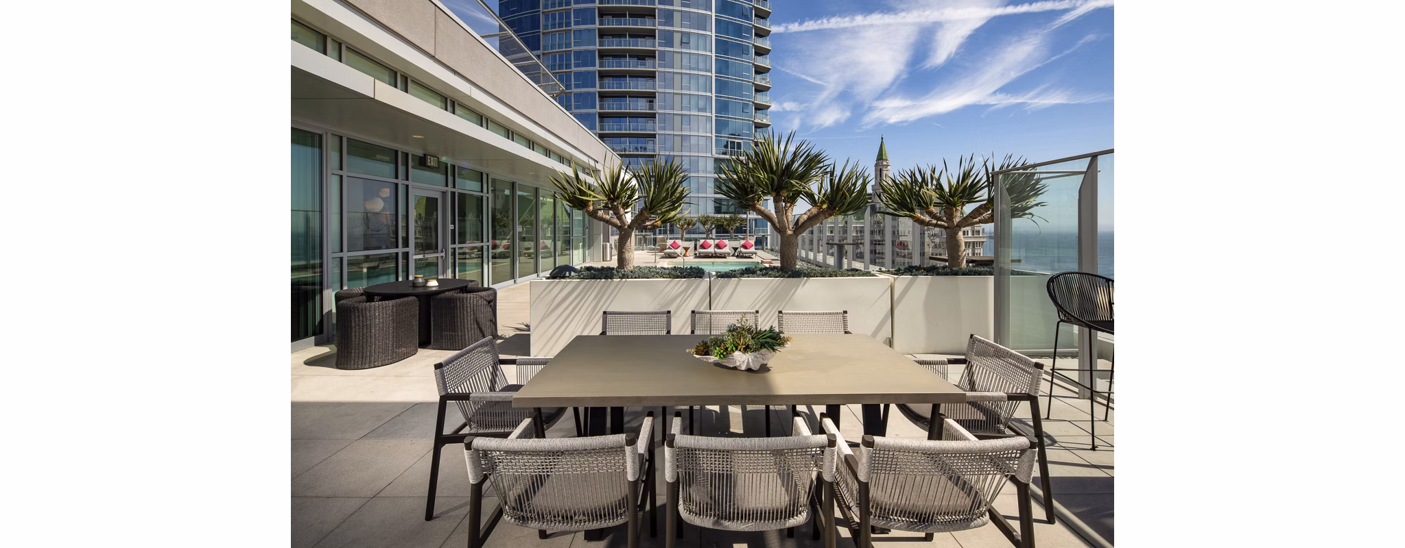 Modern outdoor patio with stylish seating at The Current Apartments, offering luxury living by Greystar in the heart of the city
