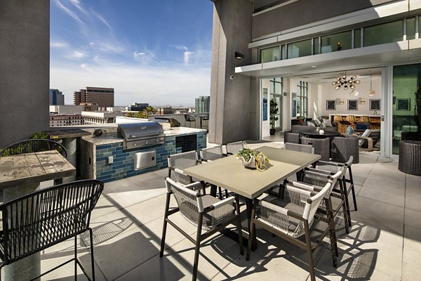 Outdoor patio with modern seating at The Current Apartments, ideal for luxury outdoor living and entertaining