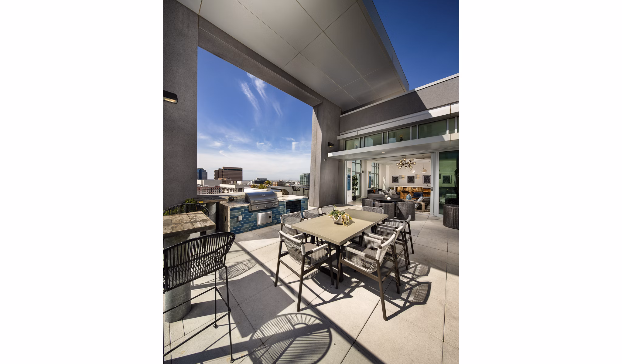 The Current Apartments: Stylish patio area with seating and greenery