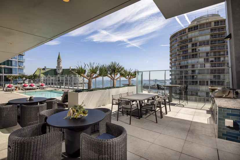 Outdoor patio with modern seating at The Current Apartments, offering luxury living in a vibrant community atmosphere