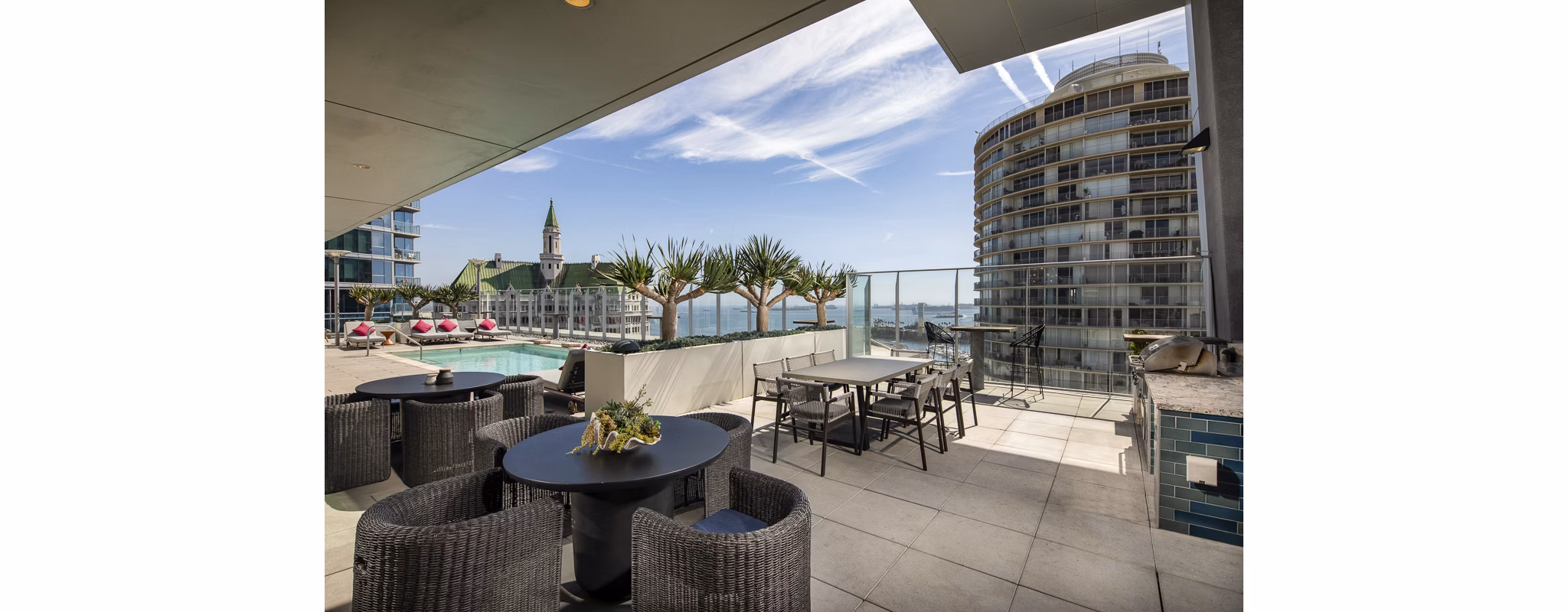 Outdoor patio with modern seating at The Current Apartments, offering luxury living in a vibrant community atmosphere