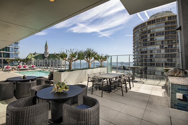 Outdoor patio with modern seating at The Current Apartments, offering luxury living in a vibrant community atmosphere