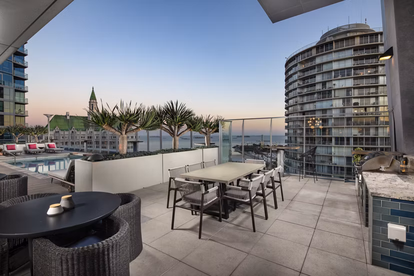 Spacious patio with cozy seating at The Current Apartments, a luxury community by Greystar featuring modern outdoor living spaces
