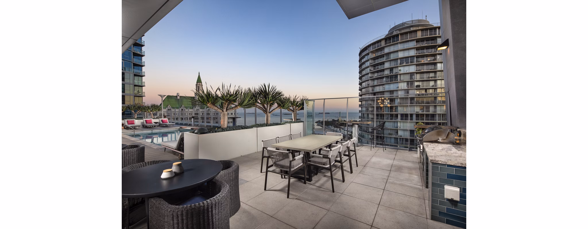 Spacious patio with cozy seating at The Current Apartments, a luxury community by Greystar featuring modern outdoor living spaces