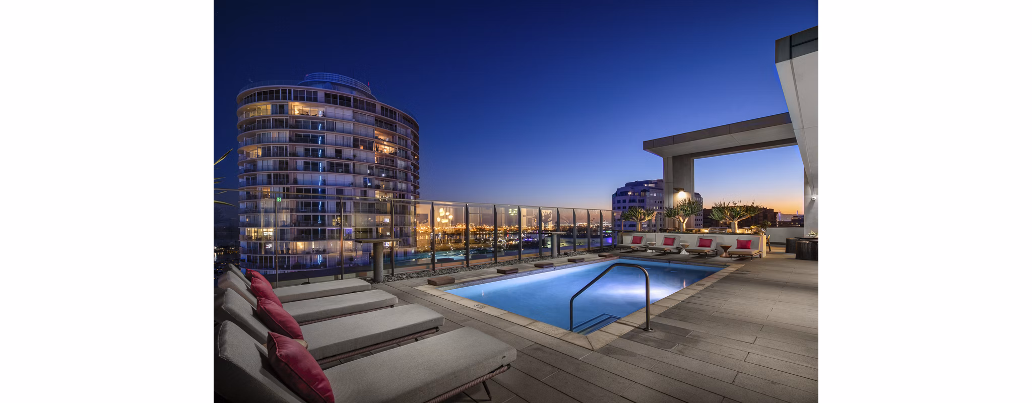 Rooftop infinity pool offering skyline views at The Current Apartments, luxury living by Greystar