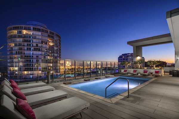 Rooftop infinity pool offering skyline views at The Current Apartments, luxury living by Greystar