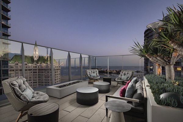Cozy fire pit at The Current Apartments offering communal gatherings in a modern outdoor space