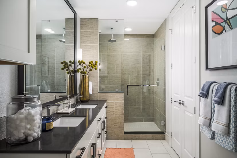 The Ryan Apartments: Modern bathroom with sleek fixtures and marble accents