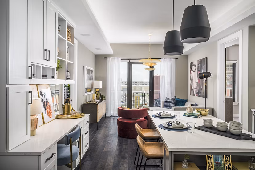 Elegant dining room with stylish decor featuring modern lighting at The Ryan Apartments