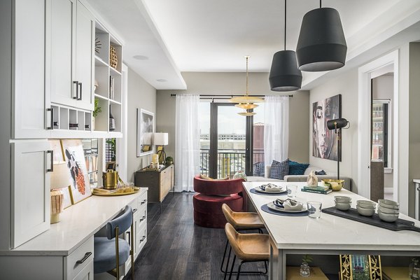 Elegant dining room with stylish decor featuring modern lighting at The Ryan Apartments