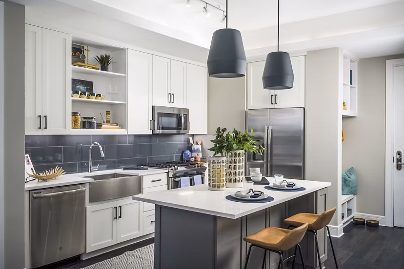 Modern kitchen with stainless steel appliances at The Ryan Apartments
