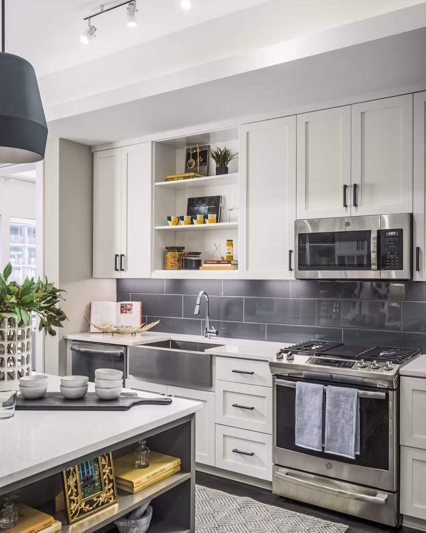 Modern kitchen with sleek countertops and stainless steel appliances at The Ryan Apartments