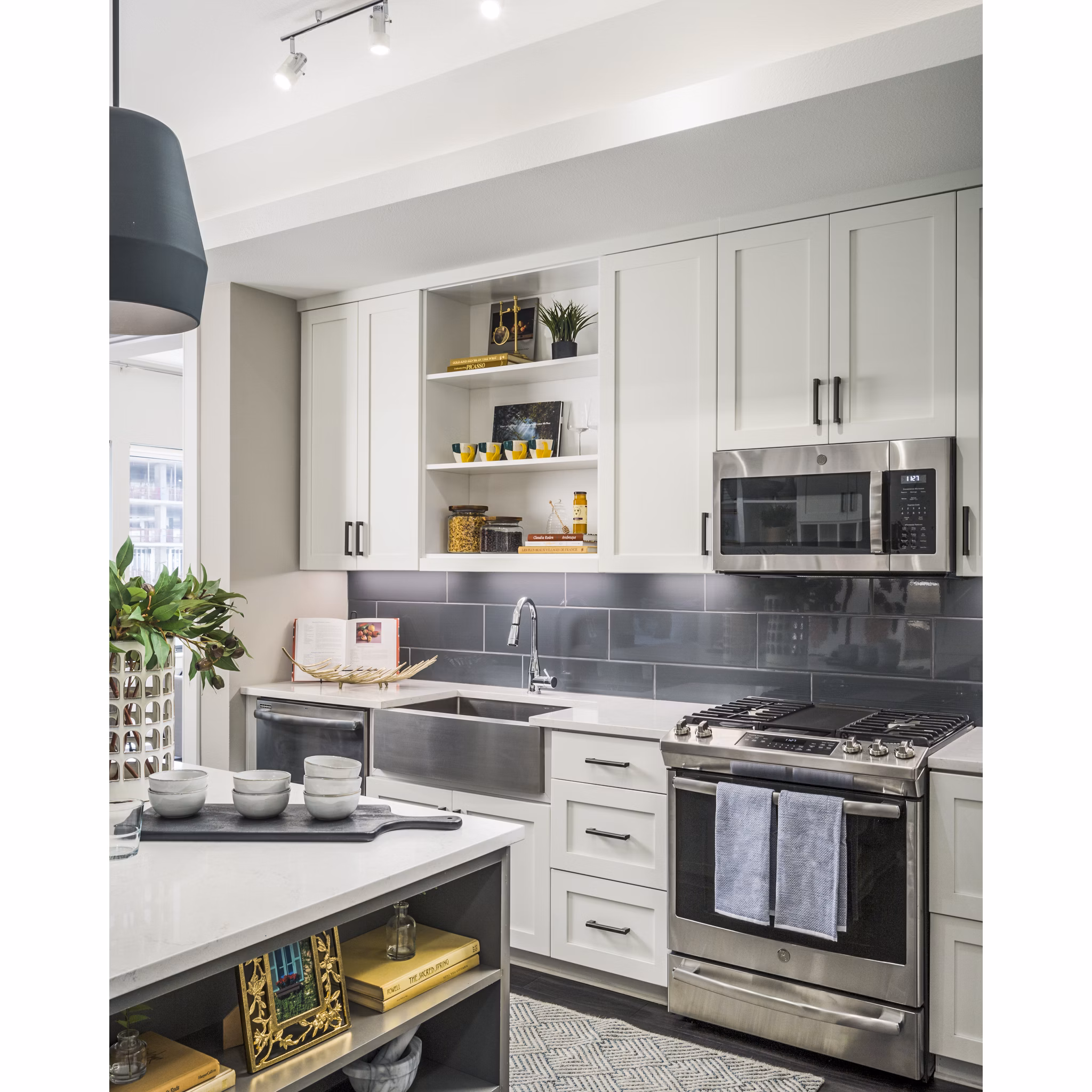 Modern kitchen with sleek countertops and stainless steel appliances at The Ryan Apartments