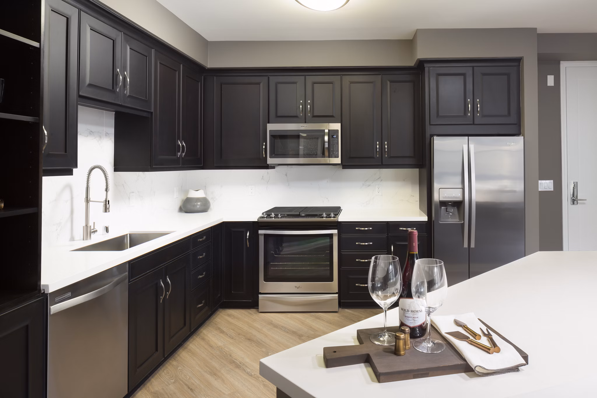 Modern kitchen with stainless steel appliances at Broadstone Arden Apartments