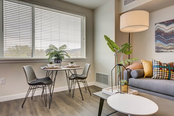 Dining area with elegant modern furniture at The Zeller Apartments, offering a luxury living experience for residents