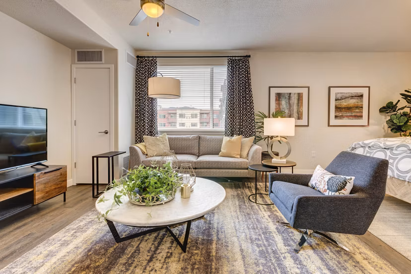 Spacious living room with modern furnishings at The Zeller Apartments