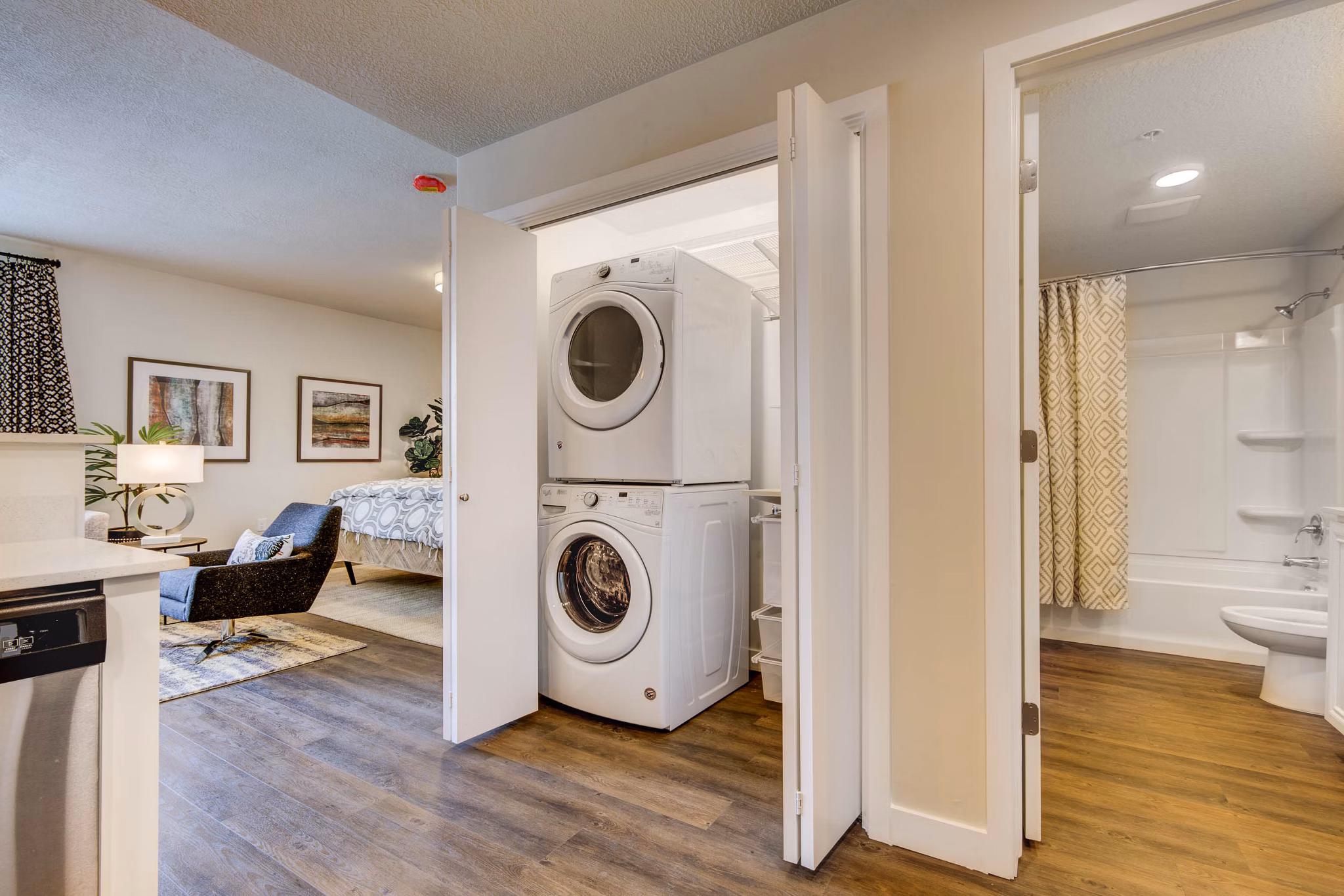 Laundry room with energy-efficient washers and dryers at The Zeller Apartments in Greystar's luxury apartment portfolio