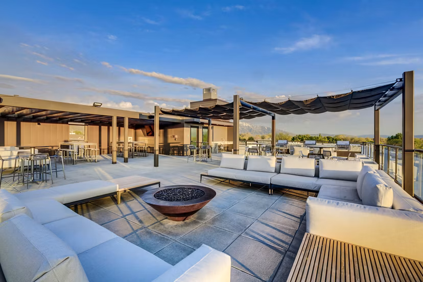Spacious patio with modern seating at The Zeller Apartments, perfect for relaxation and outdoor gatherings