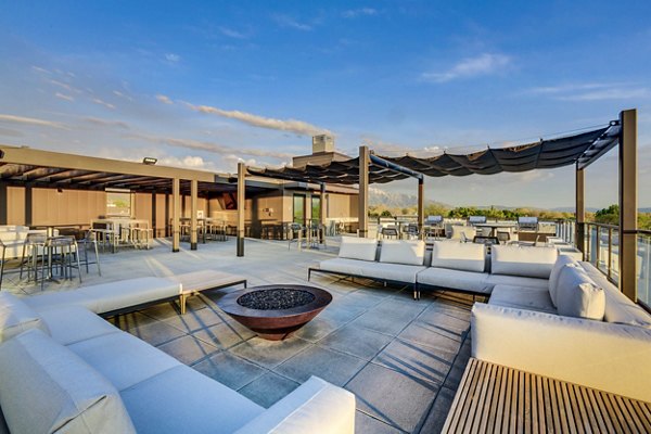Spacious patio with modern seating at The Zeller Apartments, perfect for relaxation and outdoor gatherings