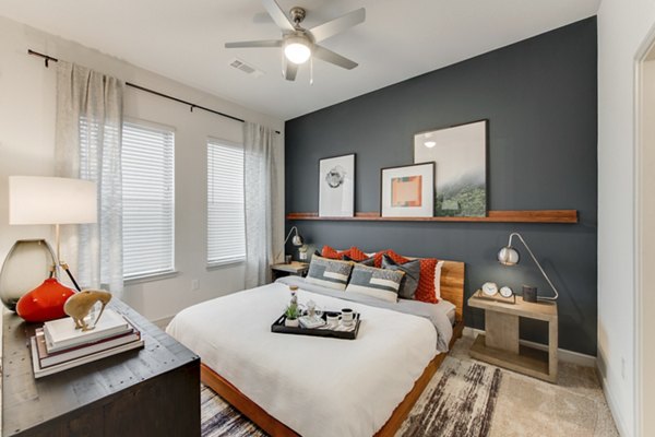 Bedroom with modern decor featuring elegant furnishings at The Silverlake Apartments