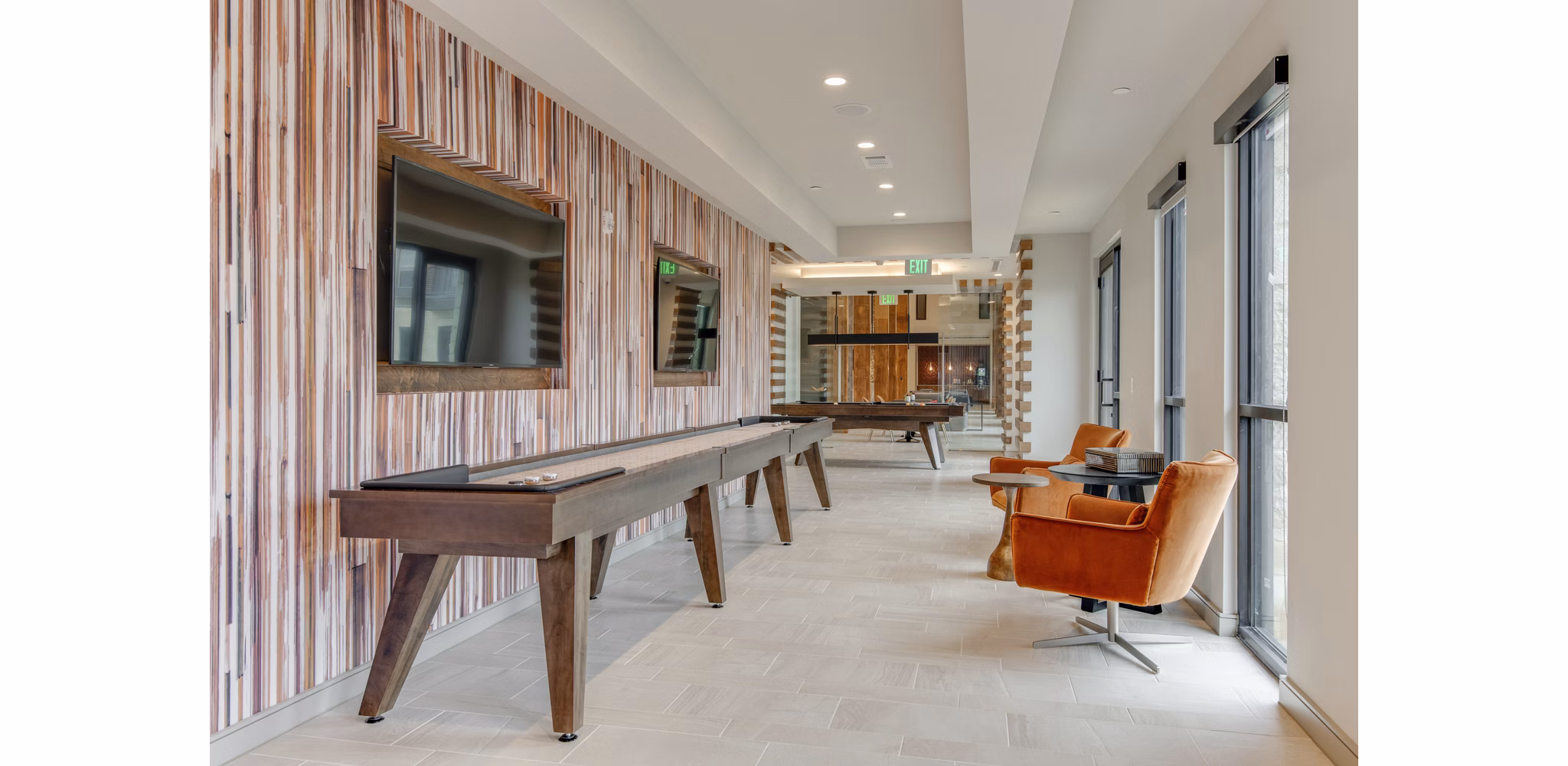 Game room featuring pool table and lounge seating at The Silverlake Apartments for entertainment and relaxation