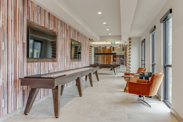 Game room featuring pool table and lounge seating at The Silverlake Apartments for entertainment and relaxation
