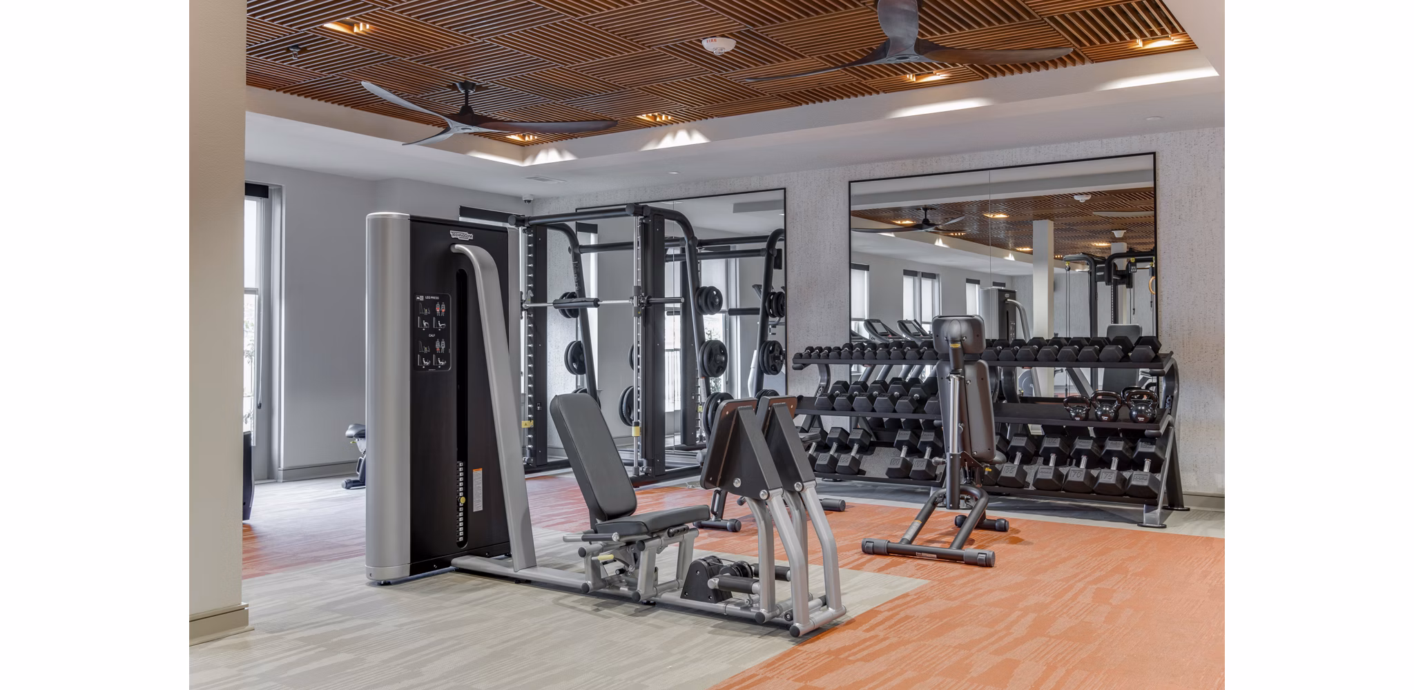 State-of-the-art fitness center equipped with modern machines at The Silverlake Apartments