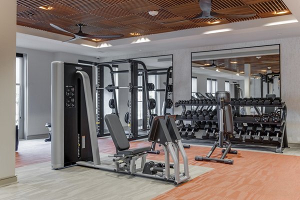 State-of-the-art fitness center equipped with modern machines at The Silverlake Apartments